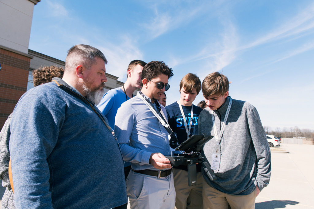 Group outside examining tech prototype